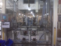 This a 2 stage special machine that loads a measured amount of powder into a cannister.