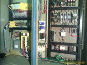 This is a picture of the interface and servo panel and the modified magnetics panel.  We gained floor space by getting rid of the old GE 1050 cabinet and took out about 50 pounds of wire.